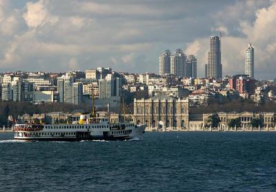 Ferry passing Dolmabahce Palace