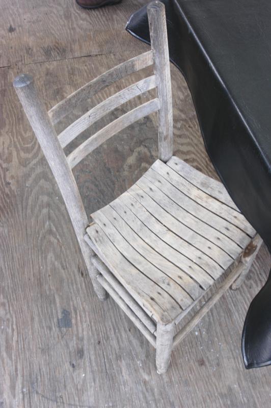 One of the old chairs; the ones that had nails that stuck out and ripped your pants.