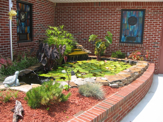fish pond out front of the church