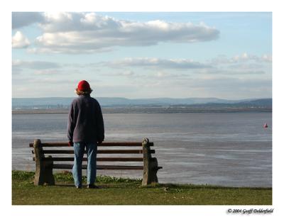 woman looking out over Estuary