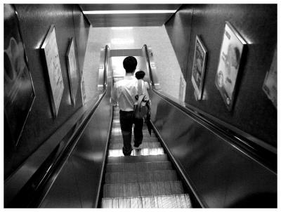 The escalators in the MTR station are so steep. There is a campaign promoting safety taking the escalator