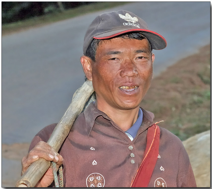 Hilltribe farmer - only the women wear colorful atire