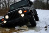 Then the Jeep falls thru the ice on the passenger side.