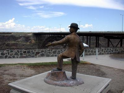 I. B. Perrine points to the Snake River in Twin Falls, Idaho