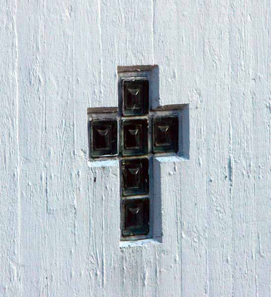cross on the wall in Fuglafjarar church