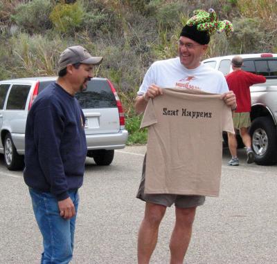 Chris Scott gives Frank Padilla a t-shirt