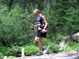 Marlis crosses a log