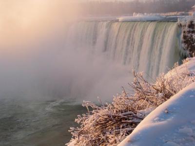 Frozen Niagara falls in warm light