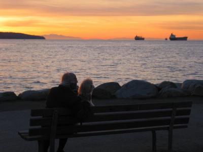 An old man and his dog at sunset Vancouver