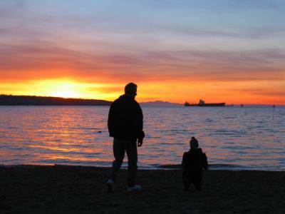 Father and his son at sunset Vancouber