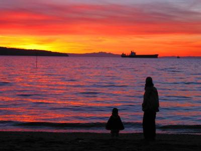 Mother and her child at sunset English Bay Vancouver