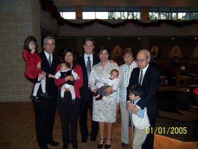 Tricia's family (Isabel, Michael, Caroline, Sophia, Lola, Lolo, and little Michael) join John, Tricia, and Evan for Evan's baptism at St. Thomas More Church in Chapel Hill, NC
