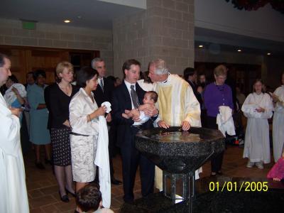 Father John prepares to baptize Evan