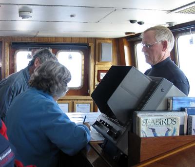 On the bridge, the official map is furiously copied.