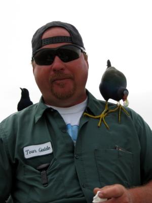 Our tour guide being swamped with sugar crazed birds