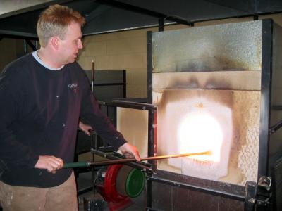 into the furnace where the liquified clear glass is stored