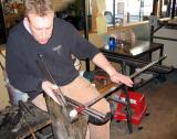 Spencer spins & molds and will add a layer of red. A small bubble is blown into the glass.