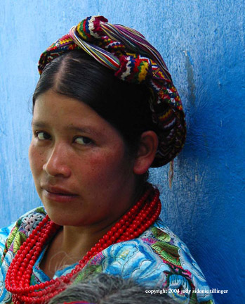 woman and blue wall, zunil, guatemala