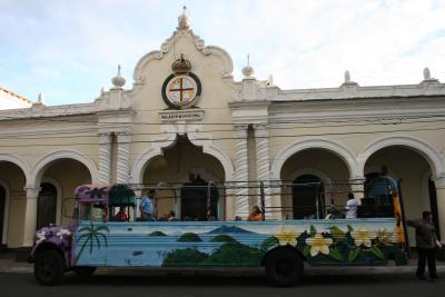 Palacio Municipal and a colorful new year's eve party bus at the central plaza
