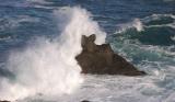 Wave crashing against Rock