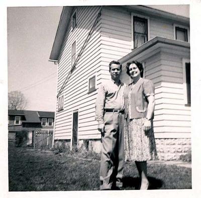 Mom and Dad in front of Our House in Aurora, Illinois