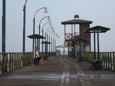 Woman sitting on Pier