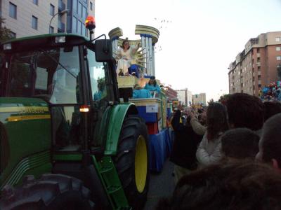 Floats with various themes pass and throw out lollies