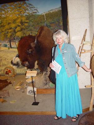 SARA WITH THE BUFFALO......WHAT IS HER HAND DOING.........