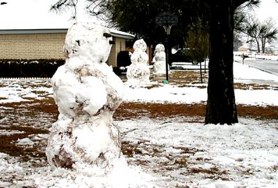 Three snowmen in a row