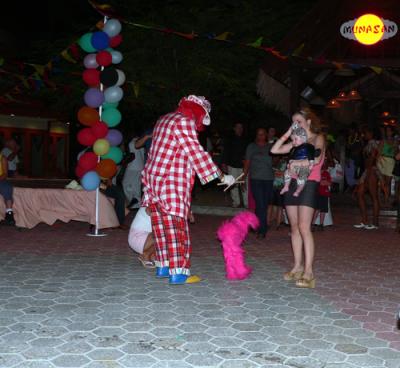 The baby was fascinated by the clown