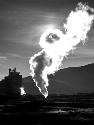 Sunrise through the steam from the power plant