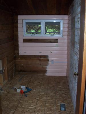 The window will eventually be inside the shower, 
so we raised and enlarged the original opening and 
installed a Milgard vinyl awning window.