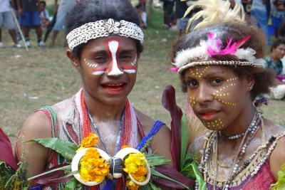 Notice the red teeth and lips from chewing betel nut