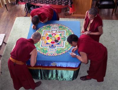 These 4 monks are working on a mandala. They had been working on it 3 days by this point. It was created to bless the Klamath Basin and heal the rifts caused by the water wars dividing the native americans, the ranchers and the feds during the summer of 2003.