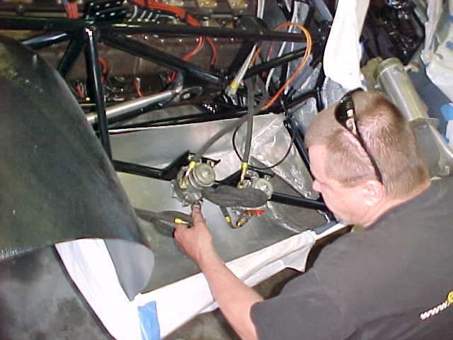 Simon ( A+ fabricator) extending the orginal fuel tank on the right side of the car. A bladder will be made to fit inside.