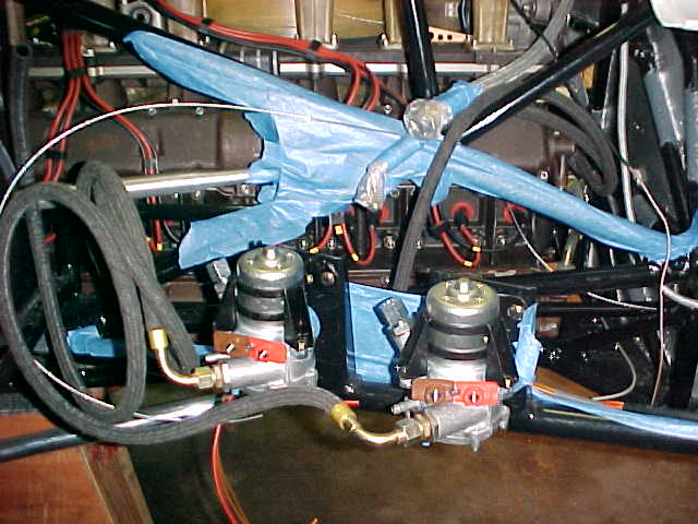 The 2 BOSCH fuel pumps on the right side of the car