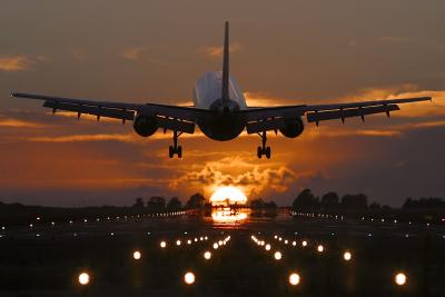 Monarch A300 landing at sunset.