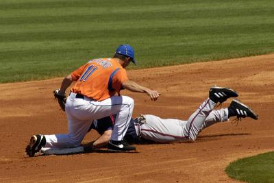 Joe McEwing laying down a tag on a steal.