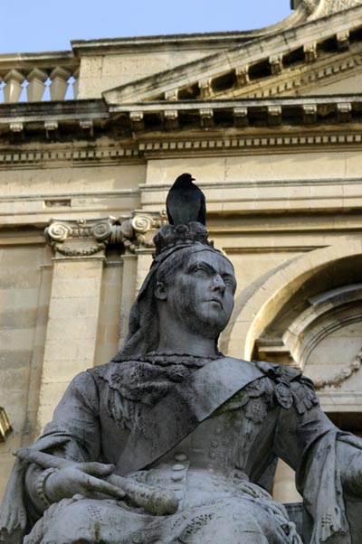 Queen Victoria wearing a crown of pigeon