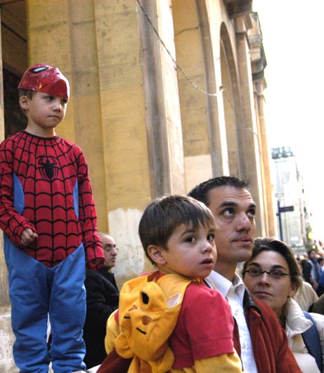 Maltese family watches the floats go by