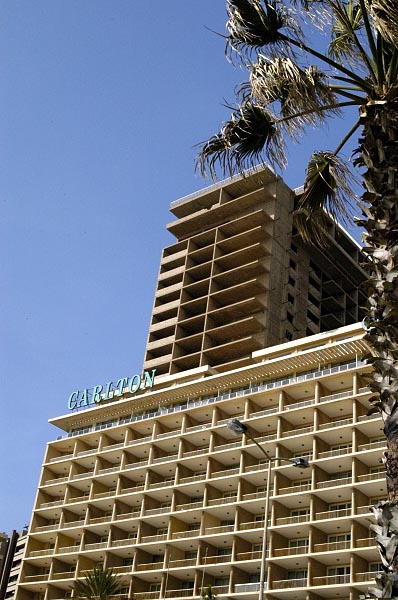 Carlton Hotel with an unrestored highrise