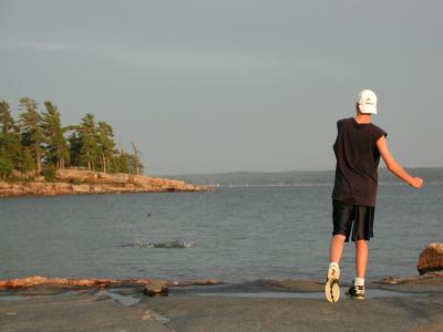 Steven, skipping stones. Killbear Park, Ontario