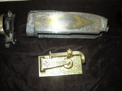 Gun receiver with gold inlay