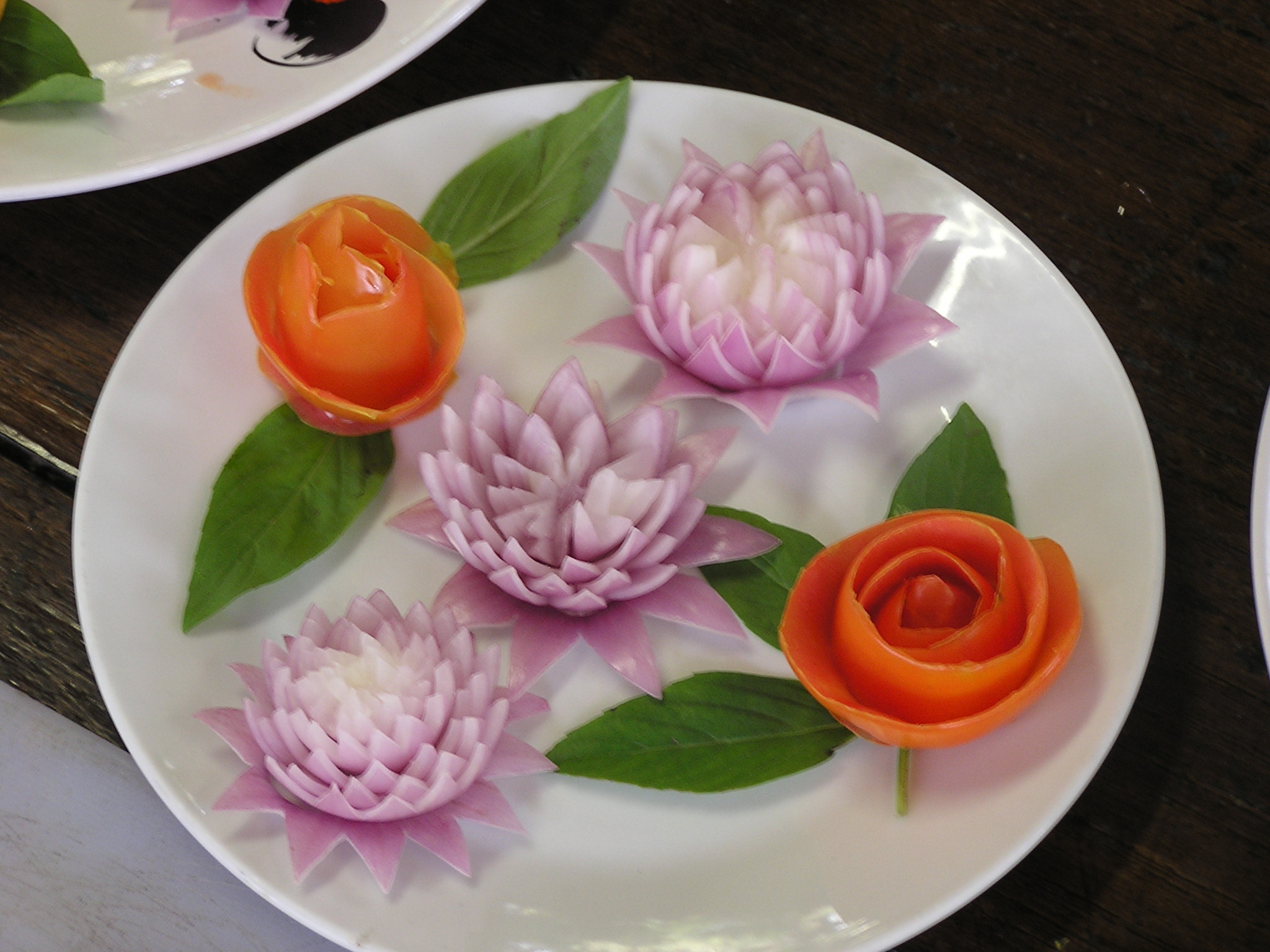 Lotus flowers of onion and roses of tomato peel (m not so good at this)