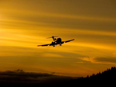 Charter America jet landing at sunset - Juneau International Airport