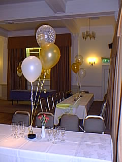 Blossoms Hotel, Chester - Clear printed balloon with babies inside with gold and ivory, gold weight
