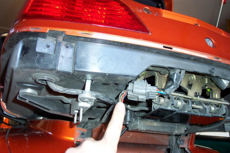 Remove the lower trunk panel to access the trunk switch sense wire in connector C16