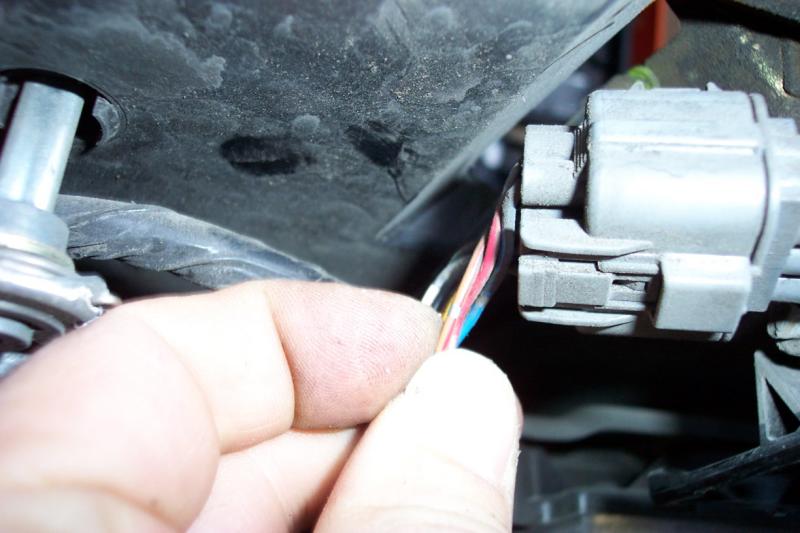 The wire you need to attach to is the brown wire with a red stripe (see page 11-1 of the ETM)