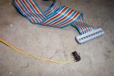 I soldered two strands of ribbon cable to the normally closed switch contacts