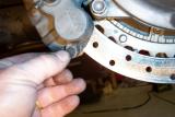 Replace rubber plug, before you ride, pump the rear brake pedal to seat the pads on the caliper. Then break the pads in gently